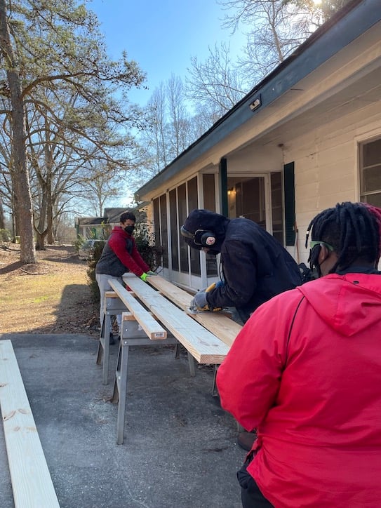 Athens Land Trust Young Urban Builders cutting lumber