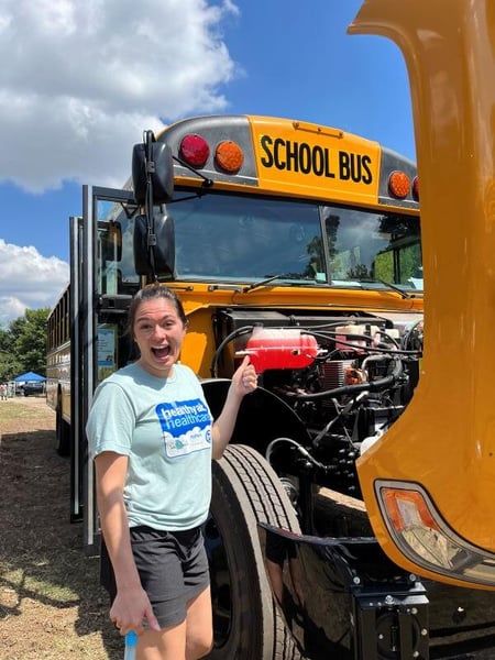 MOCA Volunteer with Bus